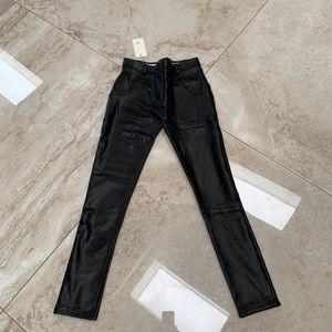 “Best Yoga Store” shiny stretch pants.